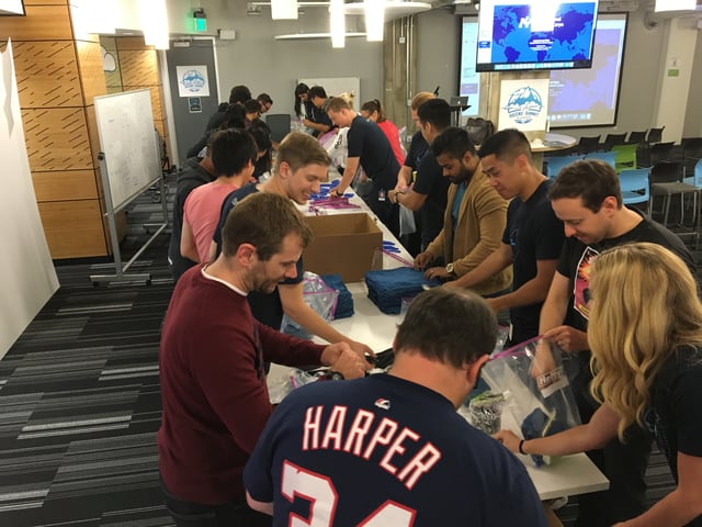 Optimizely employees prepare kits for International Medical Corps